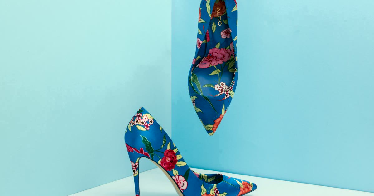 Neutral summer shoes styled on a light surface