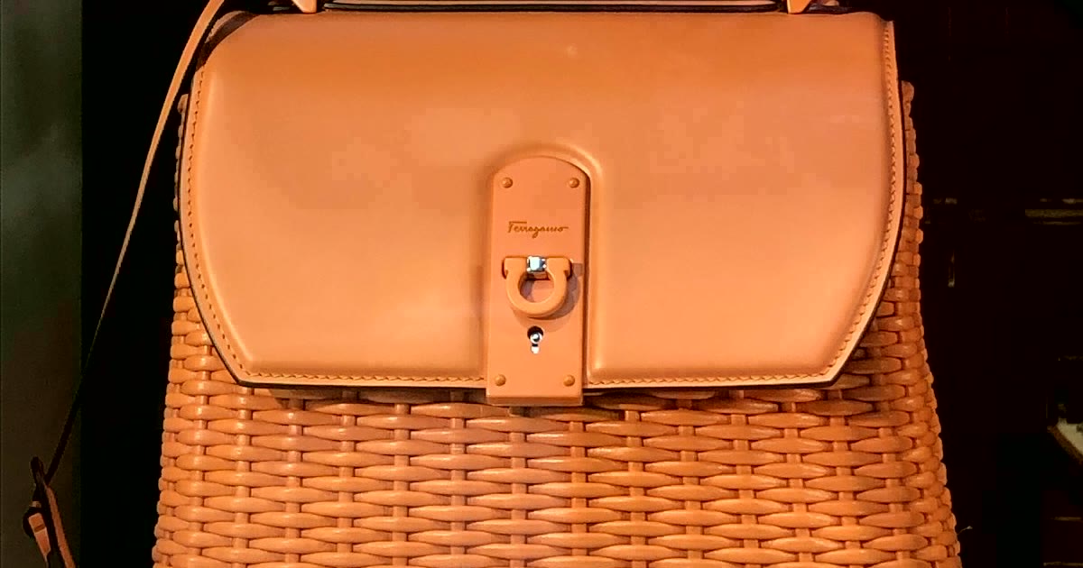 Work bag touch-up pieces arranged with lip balm, hand cream, hair clips, and small cases